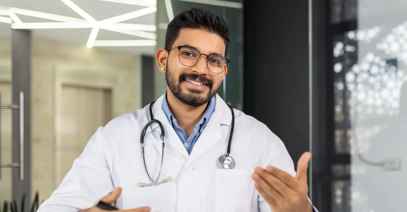 a-doctor-is-smiling-and-holding-a-clipboard-2025-03-25-09-49-17-utc (1)